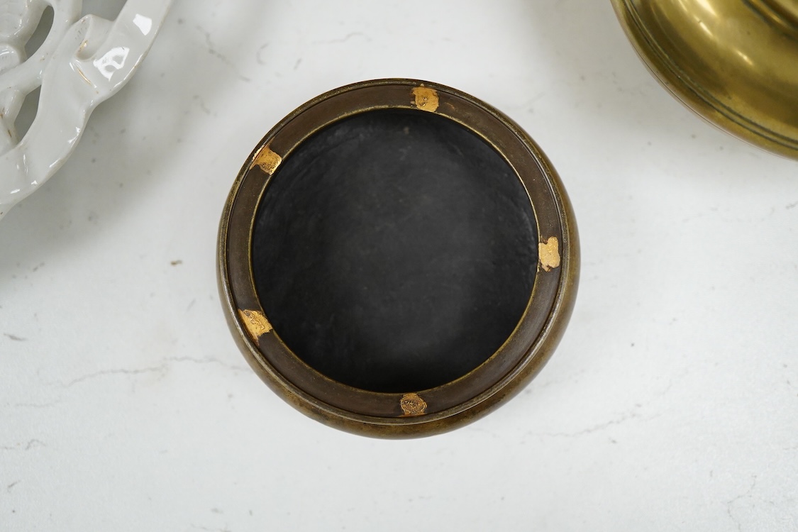 A Chinese bronze censer with gilt splashed decoration, signed with character marks to the base, together with another gilt censer, largest 12cm in diameter